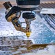 Water jet machine cutting out a part from a piece of material 