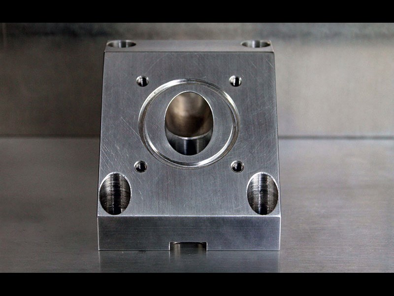 Front view of triangular part with hole in the center