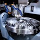 Metal cutting machinery cutting out an intricate gear
