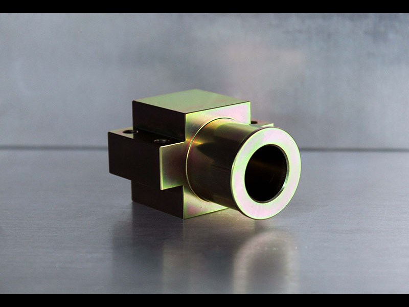 Machined part with square end and cylindrical front