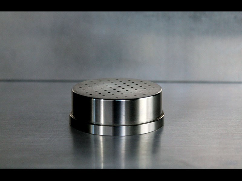 Bottom view of cylindrical part with holes